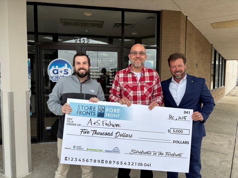 Photo of the A&S Fashions owners with their grant money check.